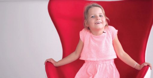 child in Willis Legal Red Chair